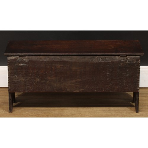 1834 - A small ‘18th century’ oak six plank chest, of child’s coffer proportions, hinged top, the front car... 