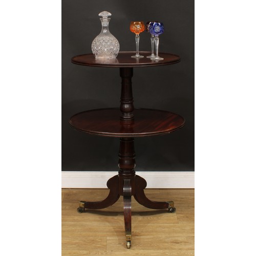 1769 - A Regency mahogany two-tier dumbwaiter, circular plateaux, turned pillar, reeded sabre legs, brass c... 