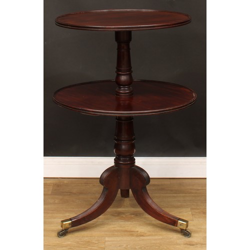 1769 - A Regency mahogany two-tier dumbwaiter, circular plateaux, turned pillar, reeded sabre legs, brass c... 