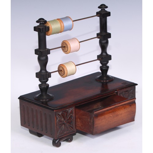 1620 - A 19th century mahogany cotton reel stand, the turned superstructure with three horizontal bob in sp... 