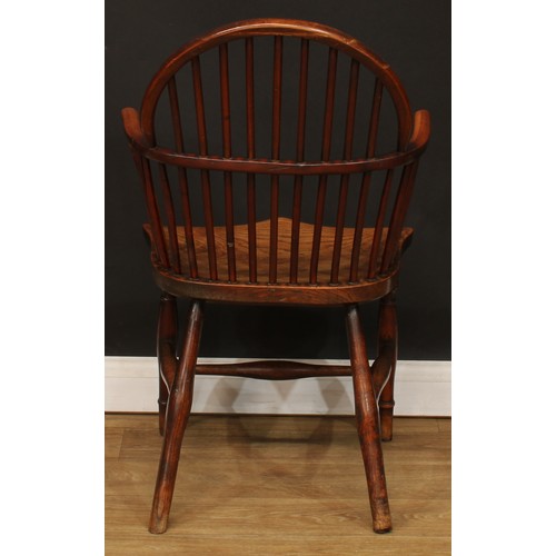 1652 - A late 18th century yew and elm Windsor elbow chair, slightly pointed low hoop back, curved arm rail... 