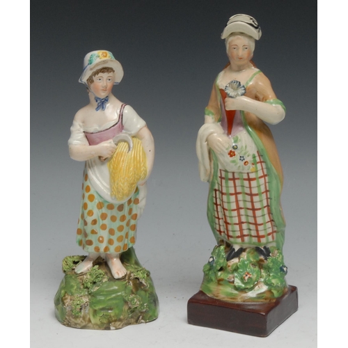 529 - A Staffordshire Pearlware figure, of a lady holding a bundle of corn and a scythe, shaped oval base,... 