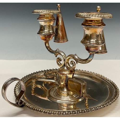 46 - An unusual Regency Old Sheffield Plate two-light double chamberstick, campana sconces, gadrooned bor... 