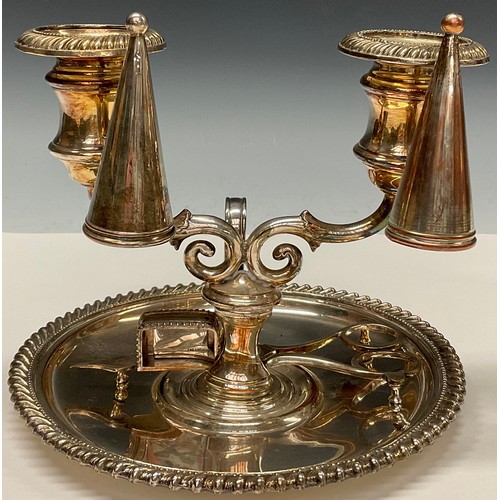 46 - An unusual Regency Old Sheffield Plate two-light double chamberstick, campana sconces, gadrooned bor... 