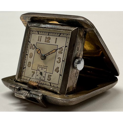 407 - An Art Deco silver purse watch, engine turned, 4cm wide, Birmingham 1938