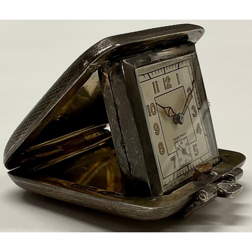 407 - An Art Deco silver purse watch, engine turned, 4cm wide, Birmingham 1938