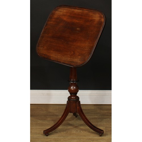 1762 - A Regency mahogany combination reading and occasional table, rounded rectangular top, turned column,... 