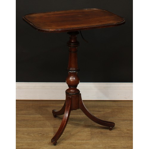 1762 - A Regency mahogany combination reading and occasional table, rounded rectangular top, turned column,... 