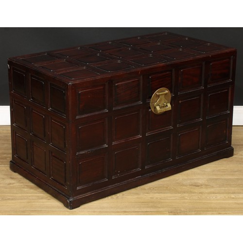 1837 - A Southeast Asian camphor lined hardwood chest, hinged top, the exterior set with rusticated panels,... 