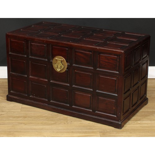 1837 - A Southeast Asian camphor lined hardwood chest, hinged top, the exterior set with rusticated panels,... 