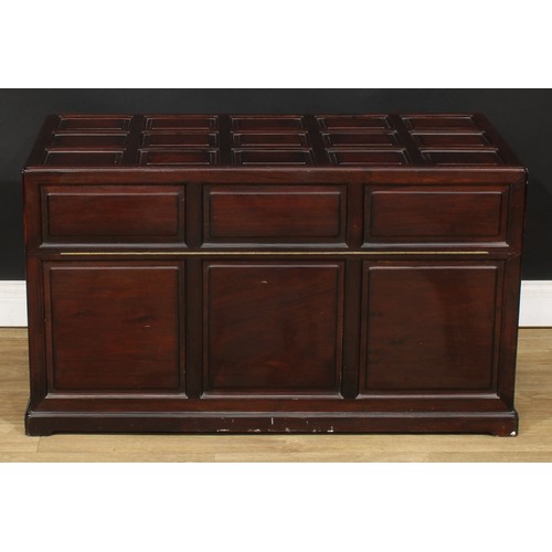 1837 - A Southeast Asian camphor lined hardwood chest, hinged top, the exterior set with rusticated panels,... 