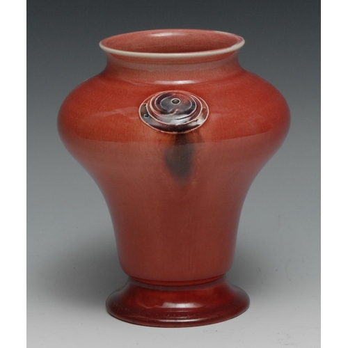 540 - A Moorcroft Flaminian pattern waisted ovoid vase,  glazed in red, with three floral roundels, 16cm h... 