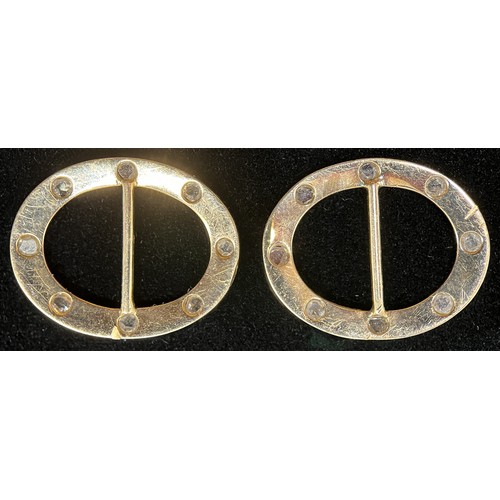 441 - A pair of Victorian oval diamond and gold coloured metal buckles, quite plain, set with eight evenly... 