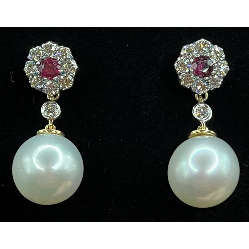 448 - A pair of 18ct gold 11mm pearl drop earrings, suspended from ruby and diamond flowerheads