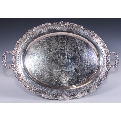 68 - A 19th century American silver plated two-handled oval serving tray, pierced border applied with fru... 