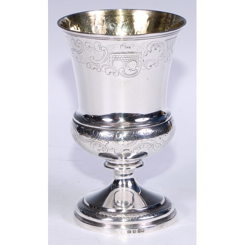 136 - A George III silver campana pedestal goblet, engraved in the Rococo taste with bands of trellis and ... 