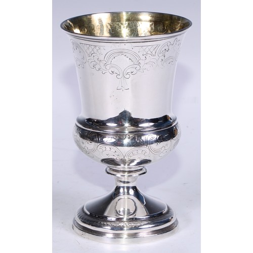 136 - A George III silver campana pedestal goblet, engraved in the Rococo taste with bands of trellis and ... 