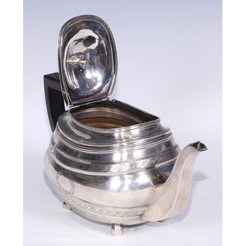 133 - A George III silver boat shaped teapot, bright-cut engraved with bands of Vitruvian scrolls, outline... 