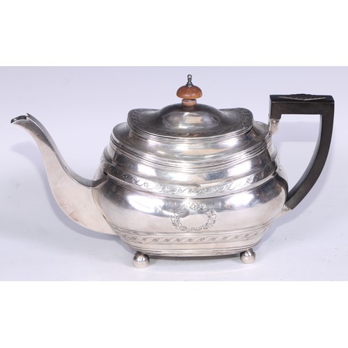 133 - A George III silver boat shaped teapot, bright-cut engraved with bands of Vitruvian scrolls, outline... 