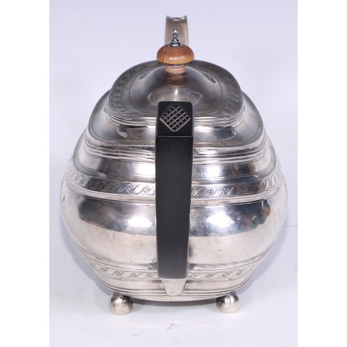 133 - A George III silver boat shaped teapot, bright-cut engraved with bands of Vitruvian scrolls, outline... 