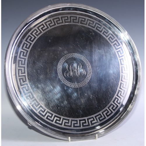 137 - A George III silver circular salver, reeded border, the field engraved with bands of Greek key, tape... 