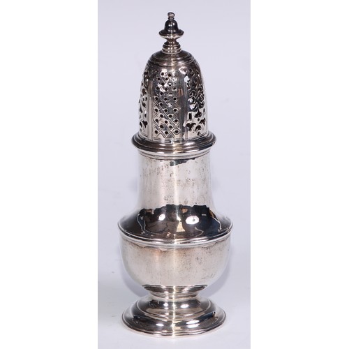 119 - A George II silver pear shaped caster, knop finial, pierced bell shaped cover, domed foot, 14cm high... 