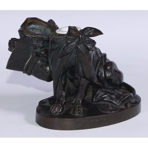 1385 - A 19th century brown patinated bronze novelty inkwell, amusingly cast as a dog wearing a bonnet and ... 