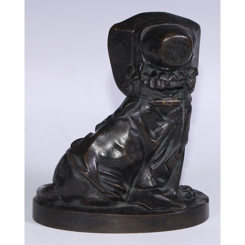 1385 - A 19th century brown patinated bronze novelty inkwell, amusingly cast as a dog wearing a bonnet and ... 