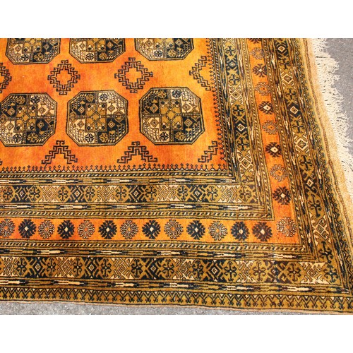 1364 - An Afghan Turkmen Ersari carpet, the central field with twelve guls interspersed with hooked medalli... 