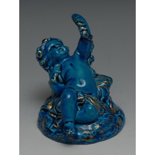 657 - A Worcester cherub, glazed overall in turquoise,  picked out in gilt, 8.5cm high, impressed mark