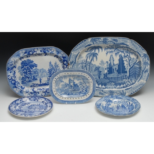 519 - A Davenport shaped rectangular meat plate, printed in underglaze blue with a country house and man f... 