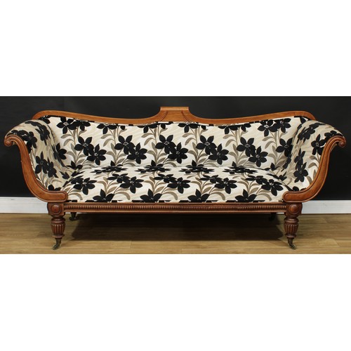 1765 - A Regency mahogany scroll-end sofa, shaped back, stuffed-over upholstery, turned and reeded legs, br... 