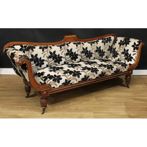 1765 - A Regency mahogany scroll-end sofa, shaped back, stuffed-over upholstery, turned and reeded legs, br... 