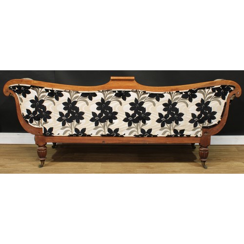 1765 - A Regency mahogany scroll-end sofa, shaped back, stuffed-over upholstery, turned and reeded legs, br... 