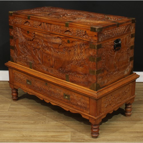 1836 - A Southeast Asian brass-mounted camphor chest on stand, hinged top enclosing a tray, carved througho... 