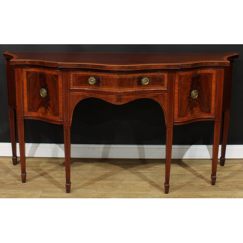 1831 - A Sheraton Revival satinwood crossbanded mahogany serpentine serving table or sideboard, slightly ov... 