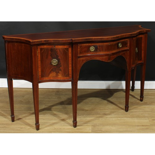 1831 - A Sheraton Revival satinwood crossbanded mahogany serpentine serving table or sideboard, slightly ov... 