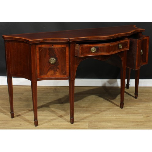 1831 - A Sheraton Revival satinwood crossbanded mahogany serpentine serving table or sideboard, slightly ov... 