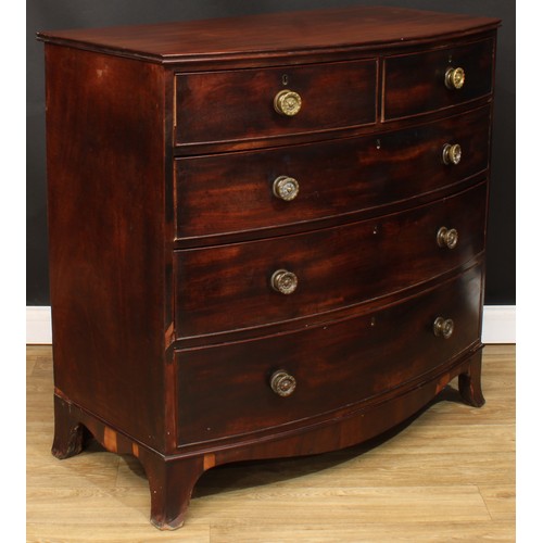 1760 - A Regency mahogany bow front chest, slightly oversailing top with channelled edge above two short an... 