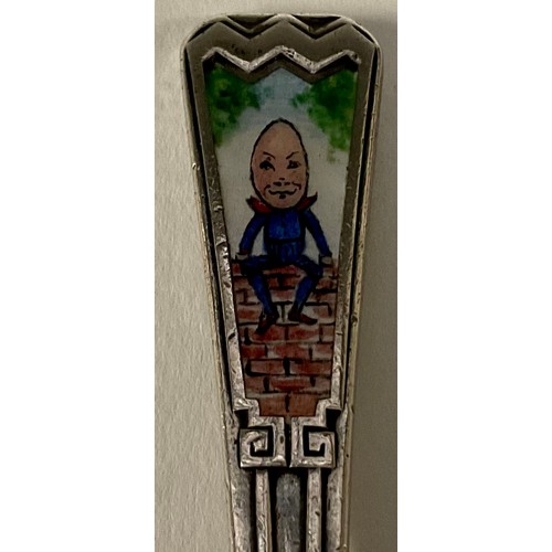 11 - An Art Deco silver and enamel christening spoon, the terminal decorated in polychrome with Humpty Du... 