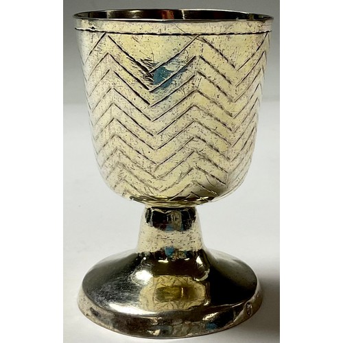 104 - A Continental silver pedestal goblet, possibly German, the bell shaped bowl engraved with chevron ba... 