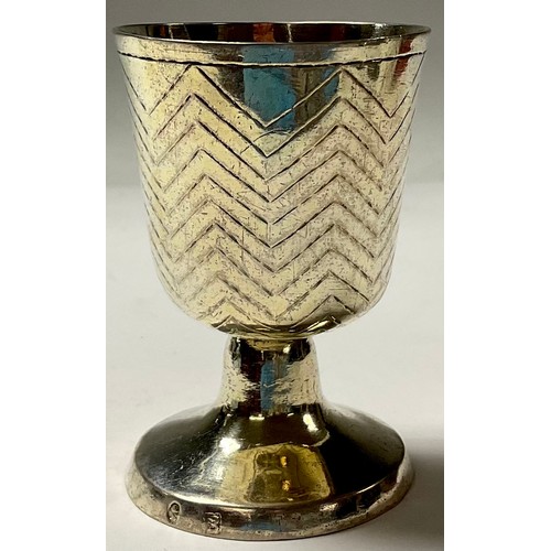 104 - A Continental silver pedestal goblet, possibly German, the bell shaped bowl engraved with chevron ba... 