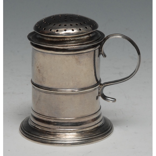 115 - A George I Britannia silver tankard kitchen pepper, domed cover, centre girdle, scroll handle, skirt... 