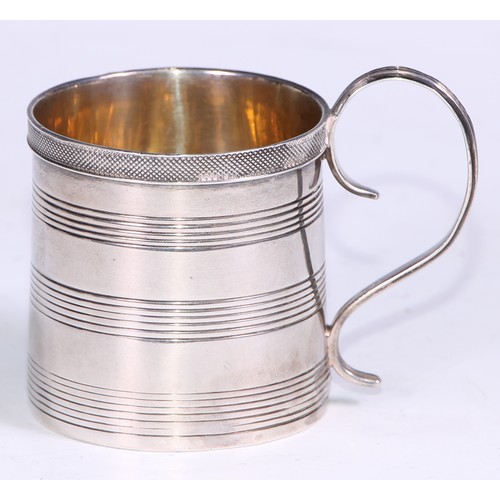 139 - A George III silver cylindrical child's mug, applied engine turned rim above three reeded bands, con... 