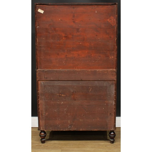 1770 - A Regency mahogany waterfall bookcase cabinet, shaped superstructure above a pair of doors enclosing... 