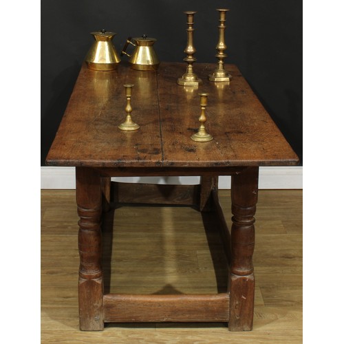 1650 - A late 17th/early 18th century oak refectory table, rectangular top, turned supports, rectangular st... 