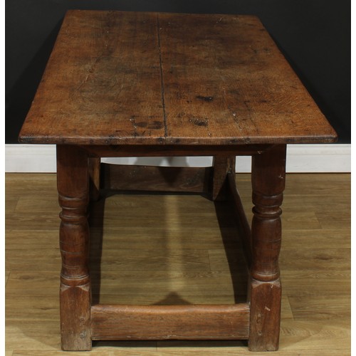 1650 - A late 17th/early 18th century oak refectory table, rectangular top, turned supports, rectangular st... 