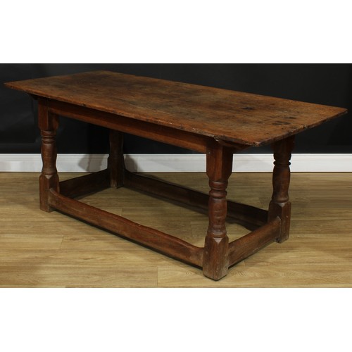 1650 - A late 17th/early 18th century oak refectory table, rectangular top, turned supports, rectangular st... 