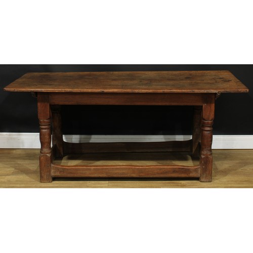 1650 - A late 17th/early 18th century oak refectory table, rectangular top, turned supports, rectangular st... 