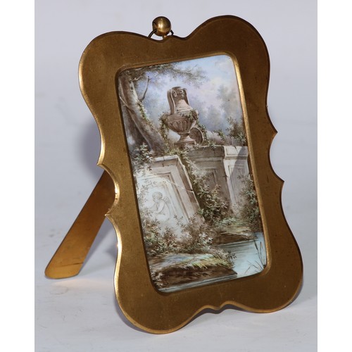 1251 - A 19th century enamel plaque, painted with a Classical urn in a romanticised Italianate setting, gil... 